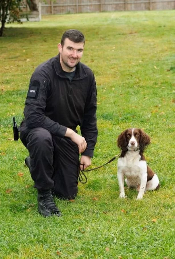 Sniffer dog Barney with his handler, PC Ben Lomax.
