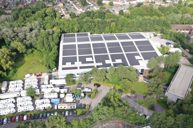 Aerial shot of TV studios with solar panels on the roofs