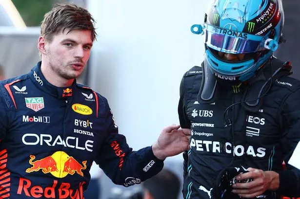 Mercedes' British driver George Russell and Red Bull Racing's Dutch driver Max Verstappen after the sprint race ahead of the Formula One Azerbaijan Grand Prix at the Baku City Circuit in Baku