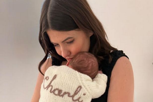 Capital FM's Aimee Vivian  holds baby Charli