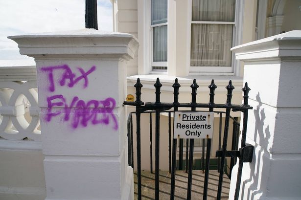 Graffiti daubed outside the apartment building in Hove