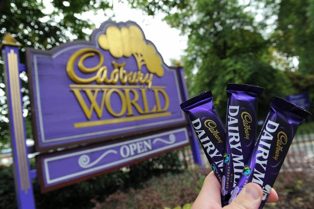 Cadbury Dairy Milk chocolate bars are pictured in front of the Cadbury World tourist attraction at the Cadbury chocolate factory in Birmingham, central England, on September 7, 2009. US giant Kraft Foods on Monday launched a 10.2 billion pound (16.7 billion dollar, 11.7 billion euro) takeover bid for Cadbury but the British confectionery maker rejected the offer, saying it was too low. Kraft said it hoped Cadbury, whose share price surged more than a third in value following the bid announcement, would eventually come round as the US company looks to increase annual revenues to 50 billion dollars a year. AFP PHOTO/PAUL ELLIS (Photo credit should read PAUL ELLIS/AFP via Getty Images)