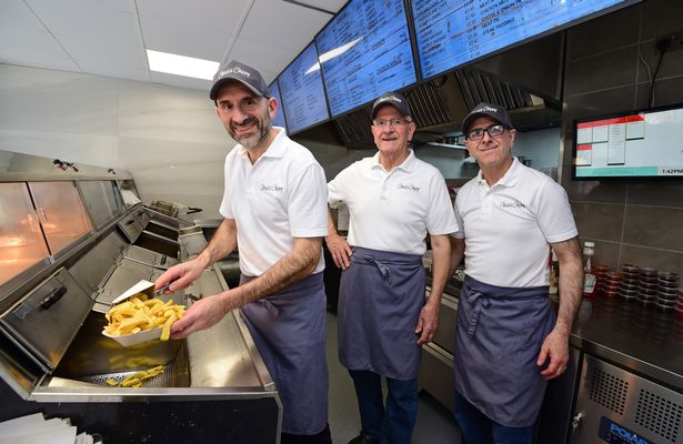 Chris's Chippy on Rose Lane, Mossley Hill which has been there for 55 years pictured Tony, Dad Chris and Costa Moustoukas