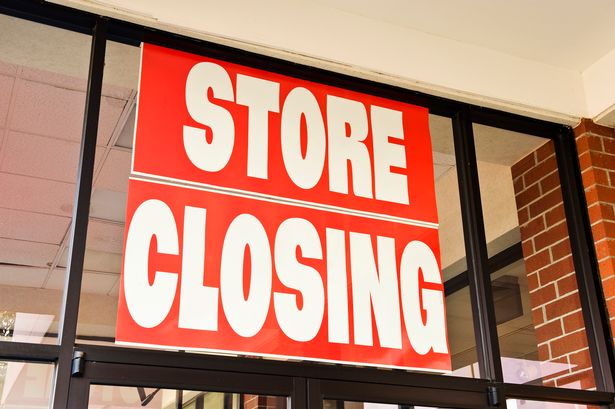 A general image of a shop window with a closing down advertisement 