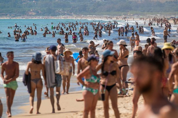 Crowded beach at Los Lances, Tarifa, Costa de la Luz, Cadiz, Andalusia, Southern Spain.