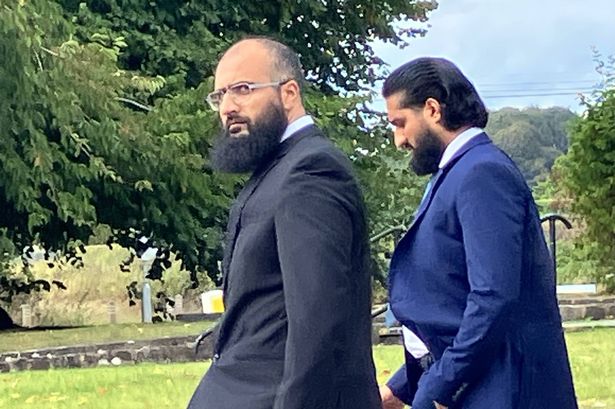 Two men outside court 
