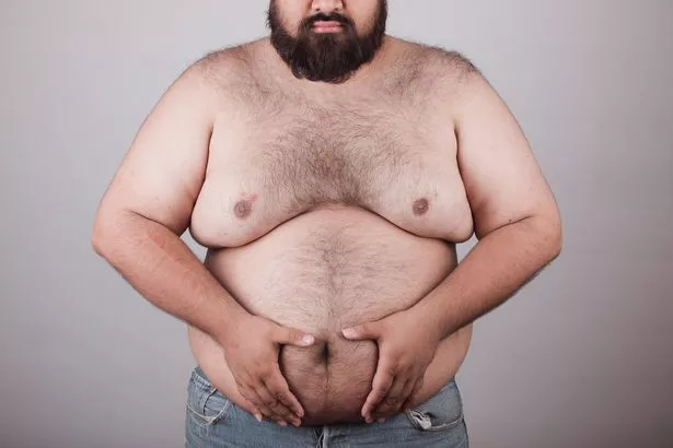 close up of male with overweight torso 