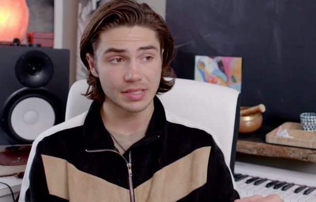 George Shelley in a black and brown jacket