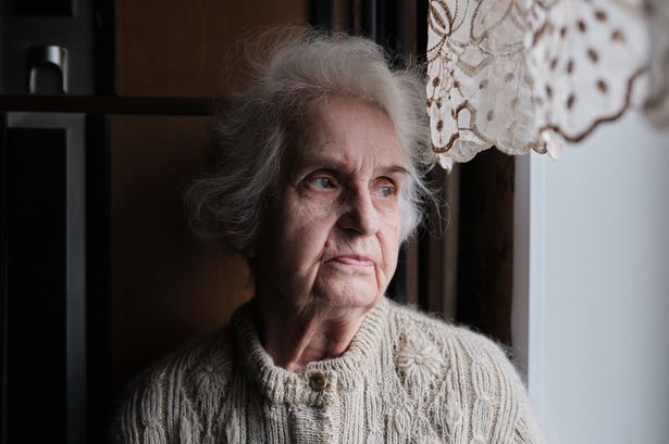 Woman looking out of window