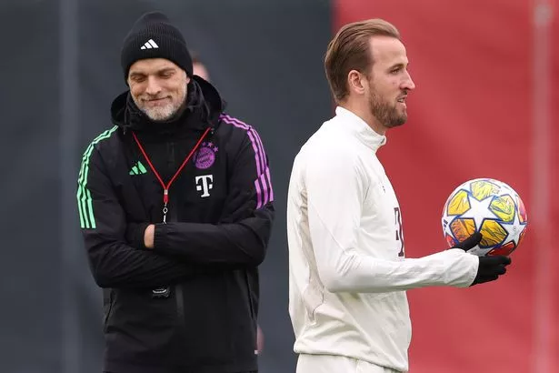 Thomas Tuchel, Head Coach of FC Bayern München looks on next to his player Harry Kane during a training session ahead of their UEFA Champions League Round of 16 second leg match at Bayern's Trainingsground Säbener Strasse on March 04, 2024 in Munich, Germany