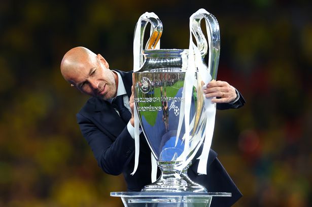 Zinedine Zidane holds the UEFA Champions League trophy