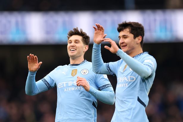 John Stones and Abdukodir Khusanov