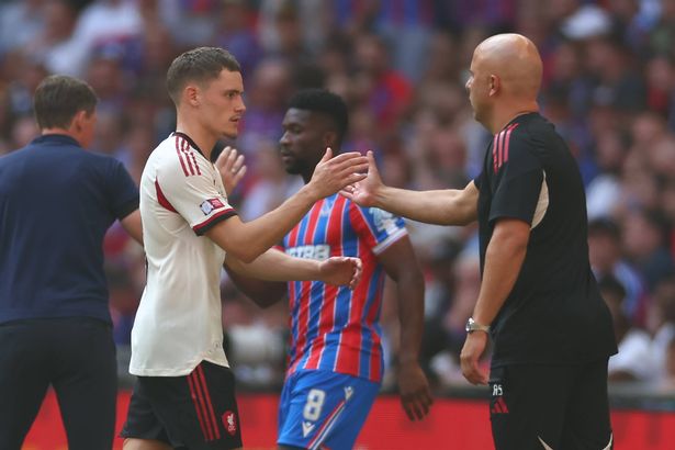 Manager Arne Slot reacts to Florian Wirtz during the 2025 FA Community Shield match