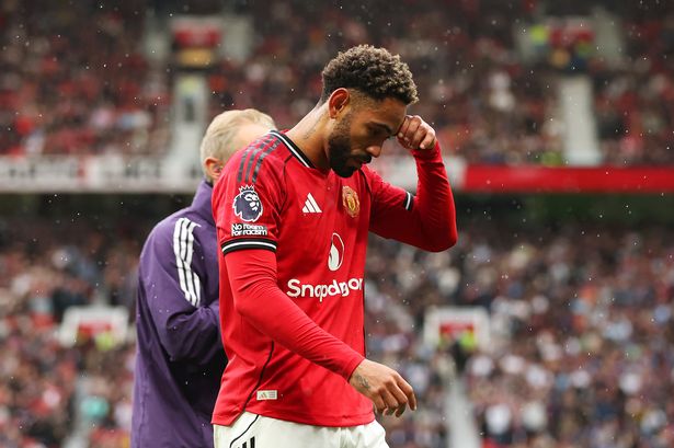 Matheus Cunha of Manchester United leaves the pitch following an injury during the Premier League match between United and Burnley 