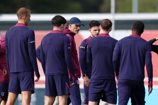 Thomas Tuchel, Head Coach of England, talks to players during a training session at St George's Park on September 04, 2025 in Burton upon Trent, England