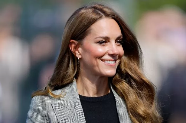 Catherine, Princess of Wales smiles at a public event