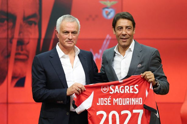 Jose Mourinho holds up a Benfica shirt alongside Rui Costa