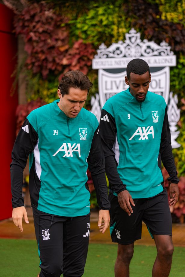 Federico Chiesa and Alexander Isak of Liverpool during a training session at AXA Training Centre on September 16, 2025 in Kirkby, England