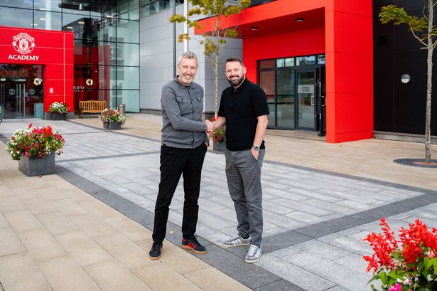 Manchester United director of football Jason Wilcox shakes hands with the club's new academy director Stephen Torpey at Carrington