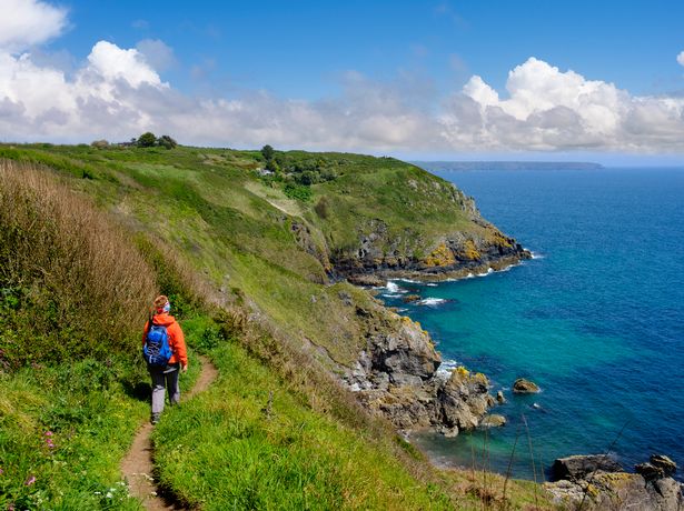 A woman hiking at the coast near Cadgwith