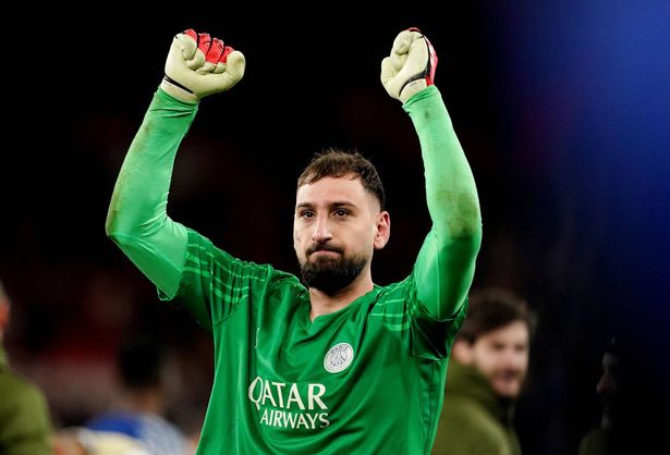 Gianluigi Donnarumma holds his hands up