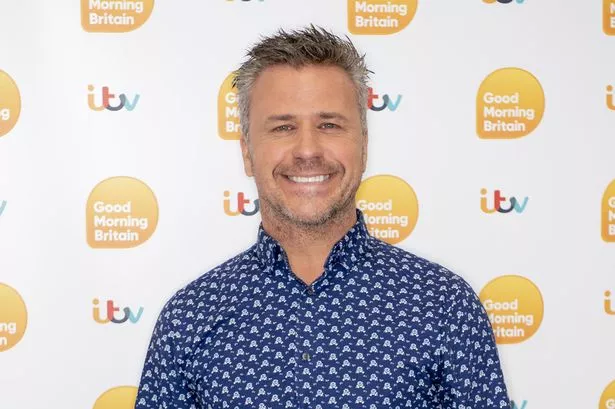 Craig Phillips in blue shirt on GMB