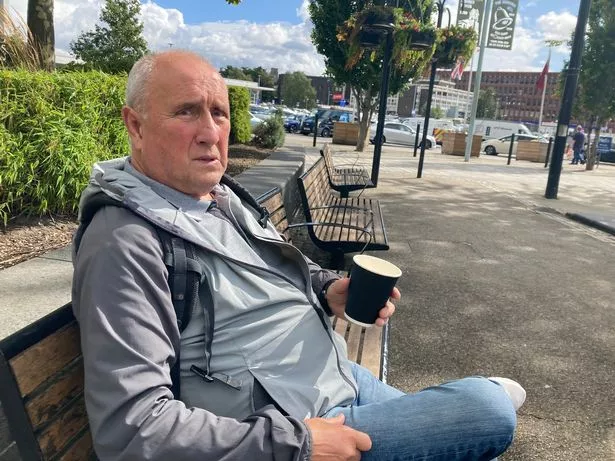 Geoff Douglas sat with a coffee in the centre of Middleton
