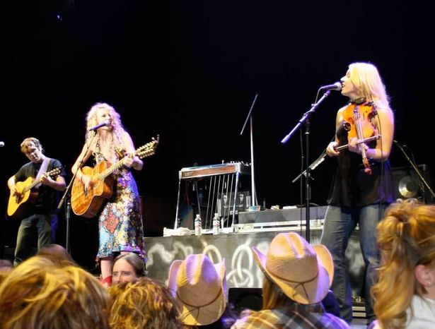 Taylor and Emily on stage during the start of Taylor's fame