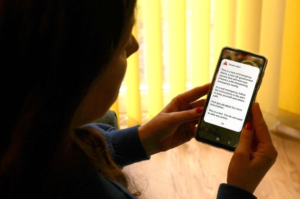 A person receiving an emergency alert test
