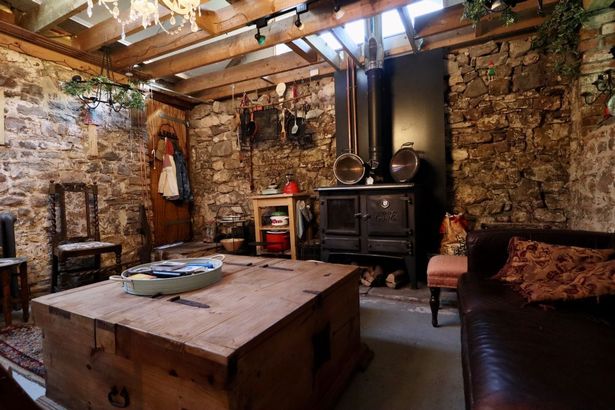 Inside the open-plan space with kitchen dining and lounge areas at a Stone Barn with Land totalling 0.79 acres between Cardiff and Caerphilly going to auction with guide price of £139,000 with Auction House Wales