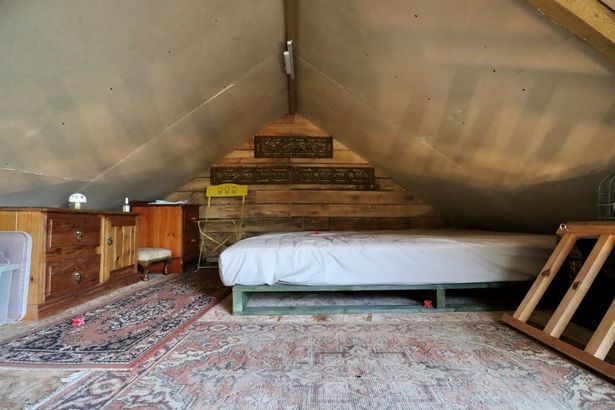 Ladder access to a mezzanine sleeping zone at a Stone Barn with Land totalling 0.79 acres between Cardiff and Caerphilly going to auction with guide price of £139,000 with Auction House Wales