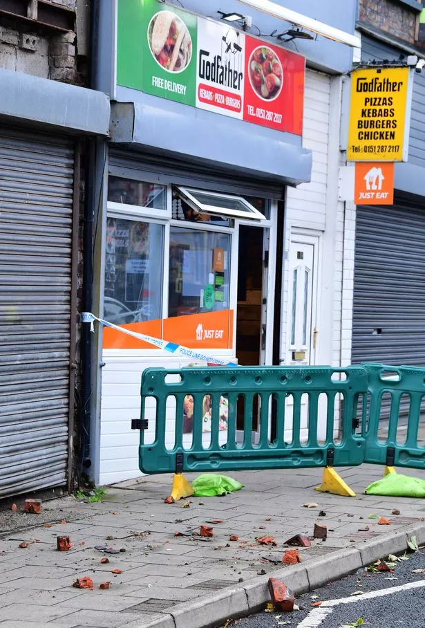 Fallen bricks from a building on the cordoned off Seaforth Road