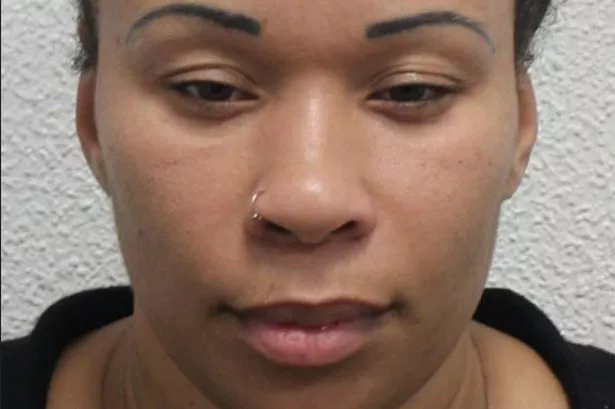 Police custody image of Jahzeen Carpenter with black hair and wearing a black top 