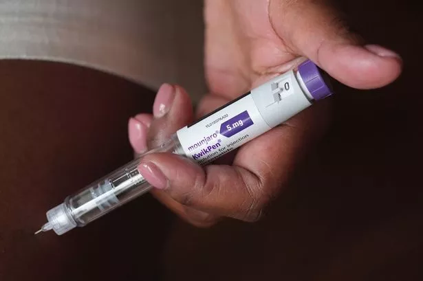 A person uses a 5mg pre-filled injection pen of Mounjaro,