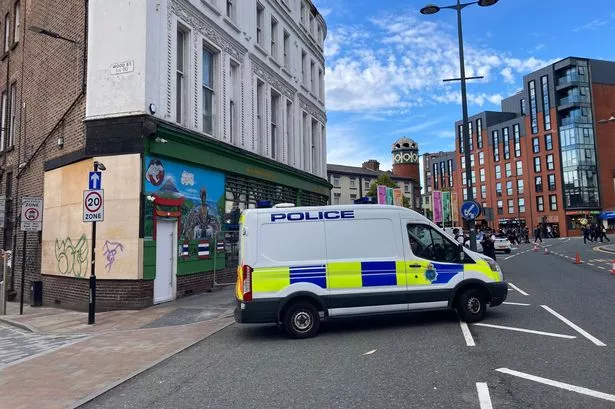 Police at the scene on Berry Street on Wednesday - A building on the corner of Bold Street and Berry Street was declared unsafe after a part of it fell onto the pavement below