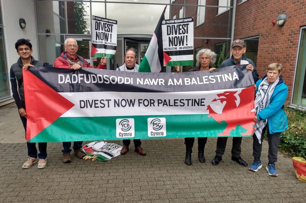 Campaigners calling for divestment from firms linked to Israel\s war on Gaza, and occupation of Palestinian territories, picketing a meeting of Monmouthshire County Council