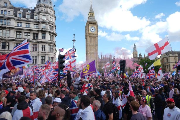 People taking part in a Tommy Robinson-led Unite the Kingdom march