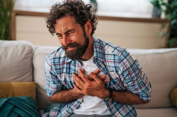 Person experiencing chest pain