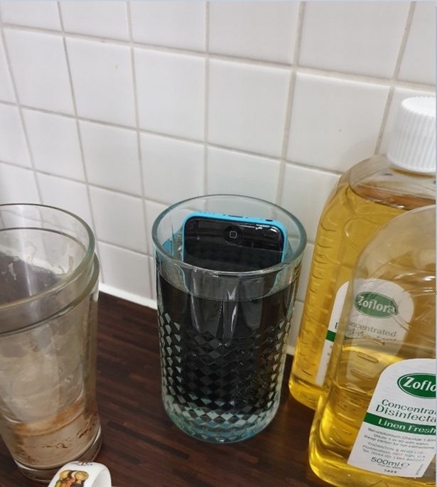 A mobile phone heroin smuggler Anthony Bowden submerged in a glass of water when police raided his home