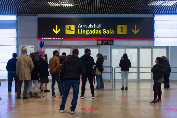 MADRID, SPAIN - FEBRUARY 25: Several people wait at one of the arrivals gates at Terminal 1 of Adolfo Suarez Madrid Barajas Airport on the day Russia announced restrictions on its airspace to British or UK-registered companies, on 25 February, 2022 in Madrid, Spain. These restrictions have been imposed in response to the sanctions imposed by London against Russia over its invasion of Ukraine. Since the early morning of February 24, Russia has started a "military operation" on Ukrainian territory. The Ukrainian President has so far confirmed the death of 137 dead and 316 wounded on his side. Russia has already entered from several flanks of the country and according to sources of the General Staff of the Ukrainian Armed Forces, at the moment, "Russian tanks are moving towards Kiev.". (Photo By Gustavo Valiente/Europa Press via Getty Images)