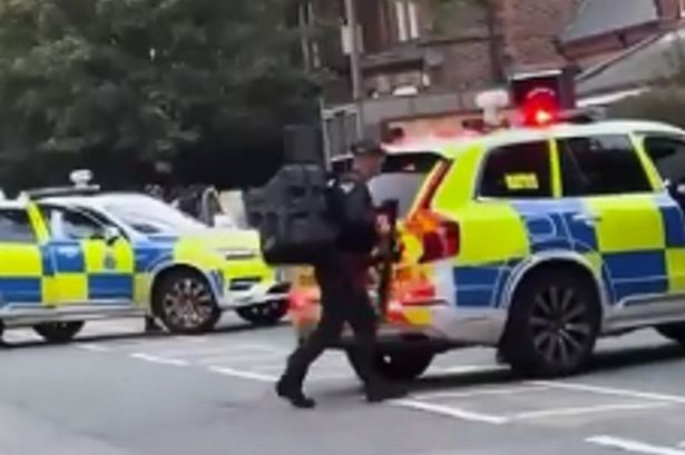 Armed police in Sheil Road, Kensington 