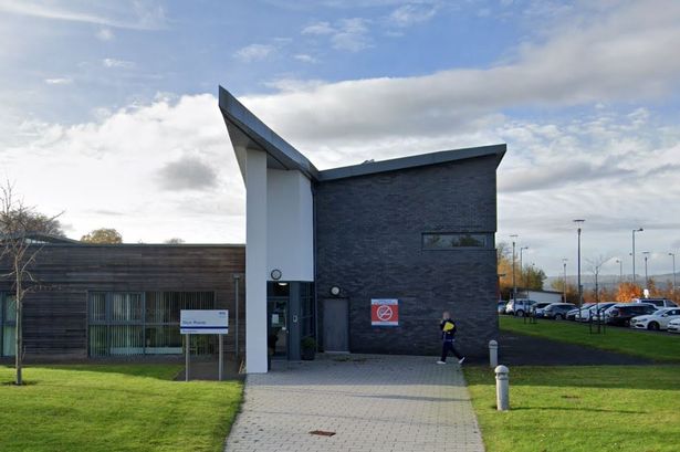An image of the exterior of a modern hospital building.