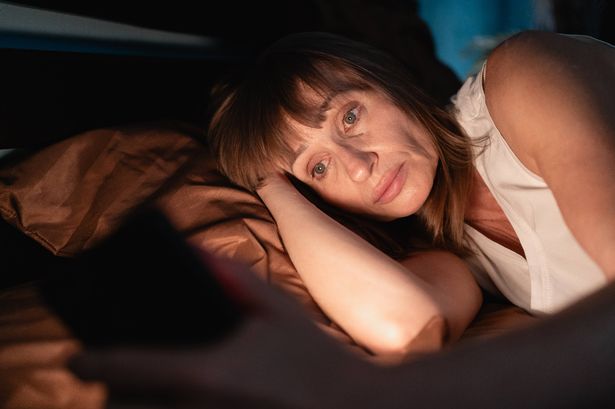 Sleepy woman awake at night