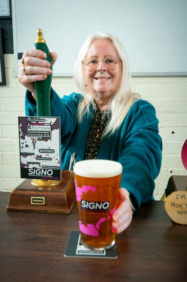 Councillor Sue Smith, cabinet member for communities and co-operation pulls the first pint of Signo at the Wakey Wakey Brew Company in Rochdale