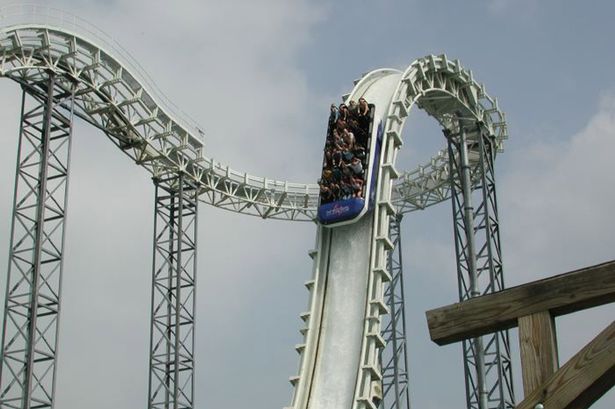 A rollercoaster, with people going down