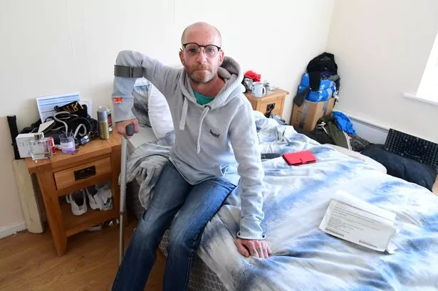 Wayne Berry at his flat in Bootle