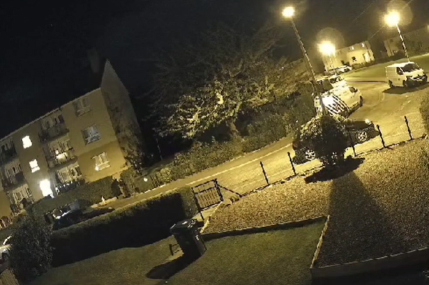 The man was captured on CCTV behind a van. 