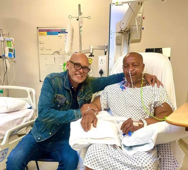 Garry Christian and Lionel Duke after the drummer underwent surgery following a cardiac arrest