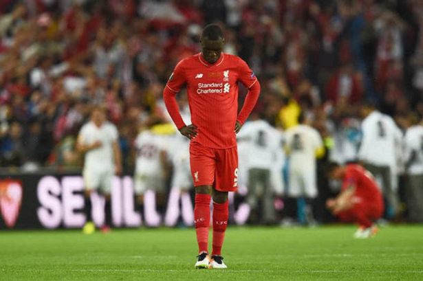 Christian Benteke looks dejected on the pitch for Liverpool