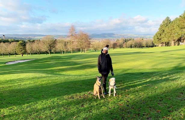 Natalie Oakes in the UK with two dogs